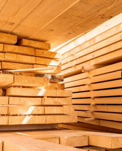 Stack of construction wood planks prepared for build a house